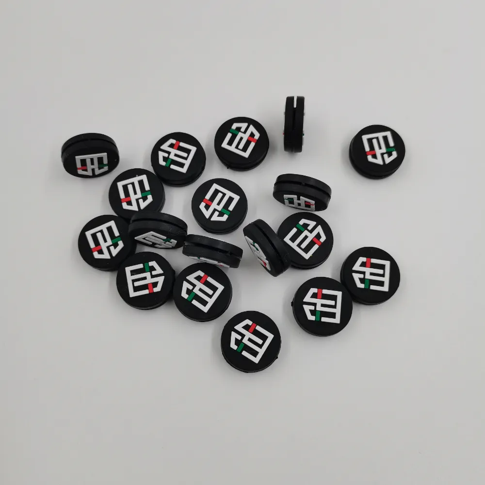 UOMO monogram custom tennis dampeners
